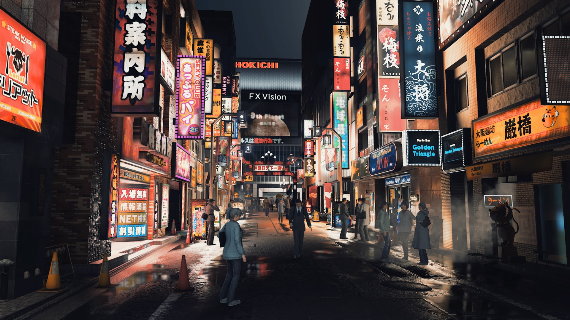 Le quartier de Karumocho, de nuit, avec de nombreux panneaux lumineux et des piétons remplissant la rue.